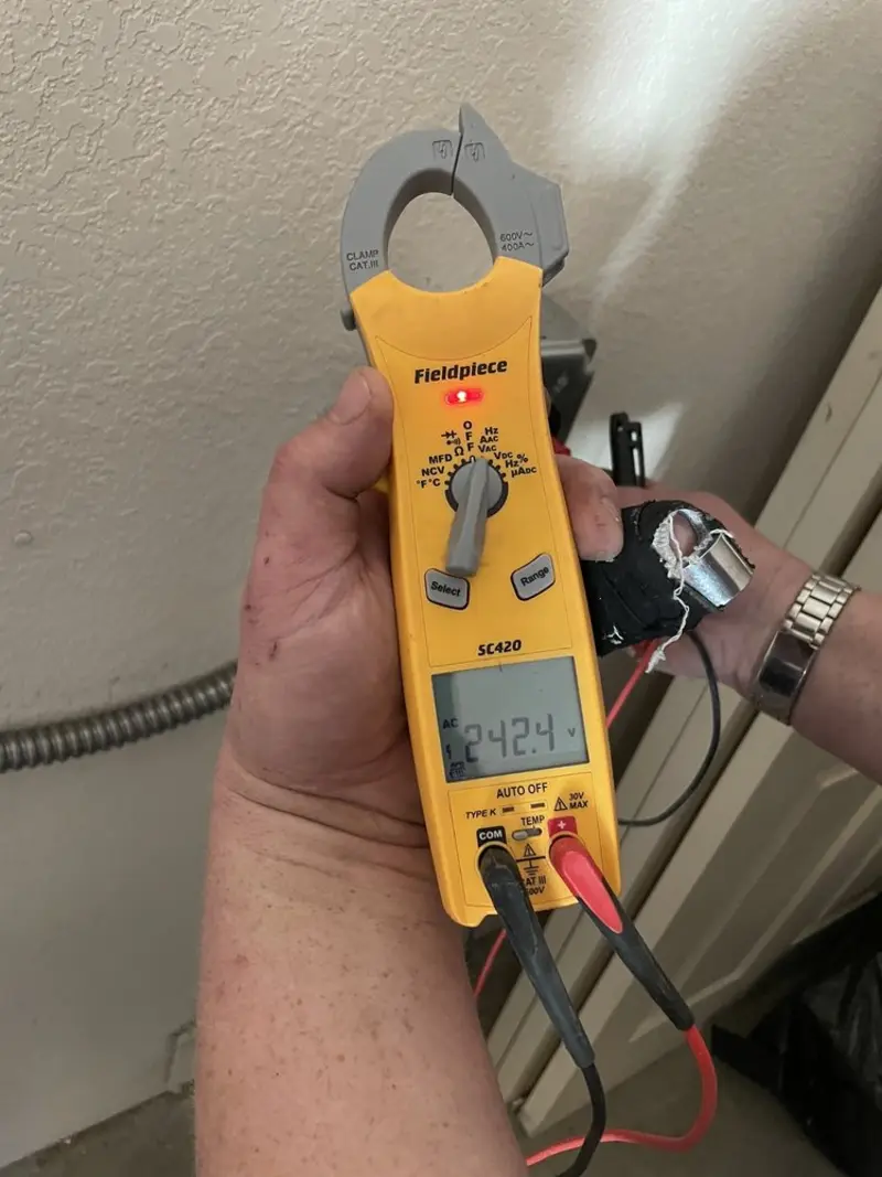 Voltage testing with clamp meter during Recessed Lighting Installation in Pelham
